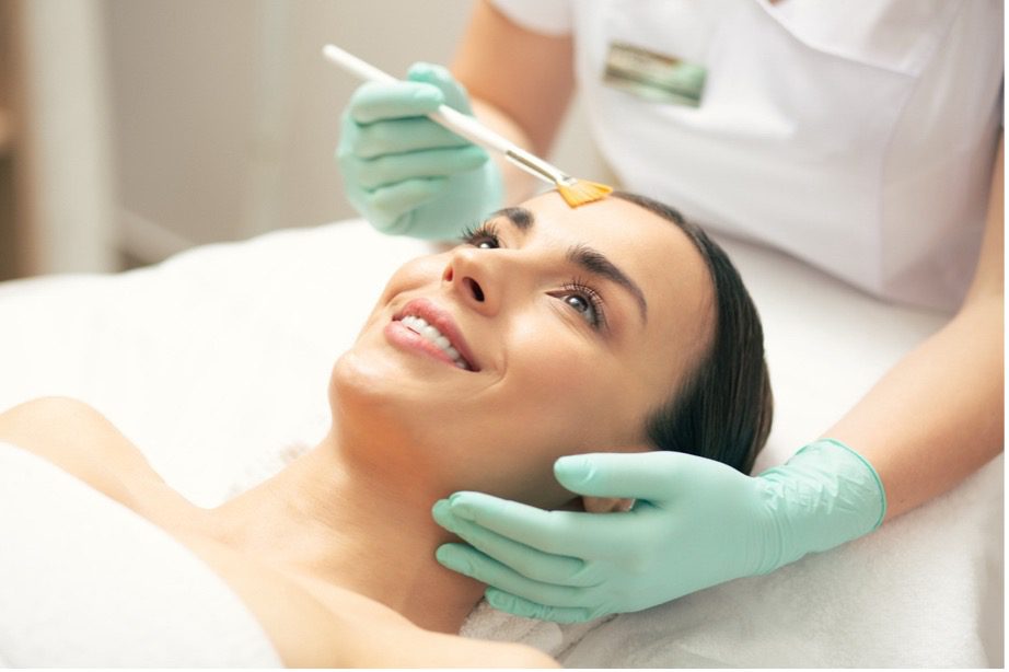 A person receiving a face massage