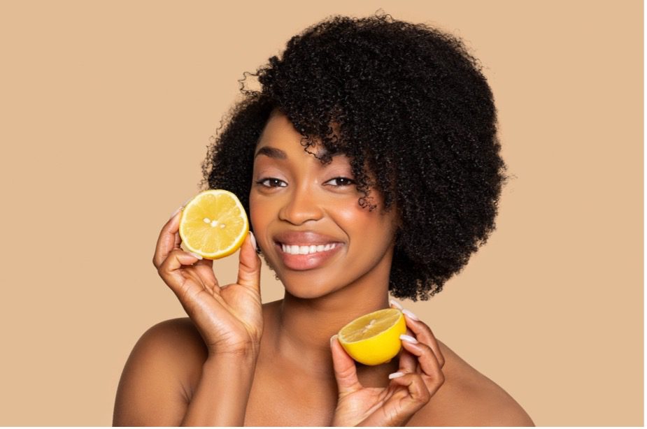 A person holding a lemon